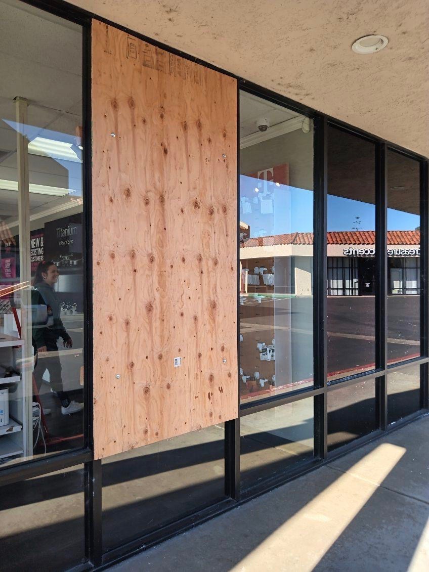 boarded up storefront window